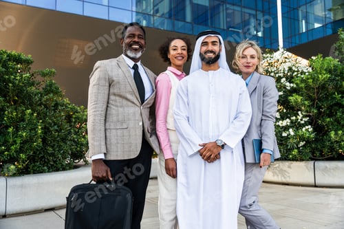 Preview: Group of multiethnic business people meeting an emirati businessman