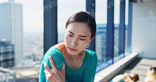 Preview: Fitness, health and shoulder pain with Japanese woman at gym for recovery or rehabilitation. Exerci