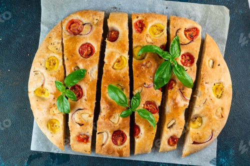Preview: Homemade Italian Focaccia top view. Focaccia with tomatoes and garlic. Food background
