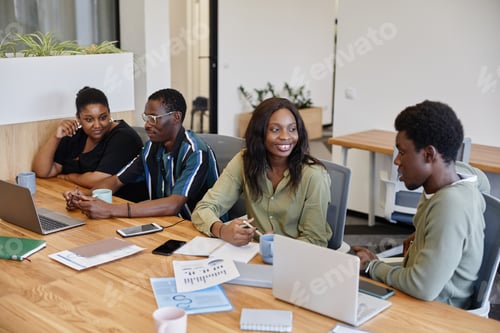 Preview: Business People Talking at Meeting Table