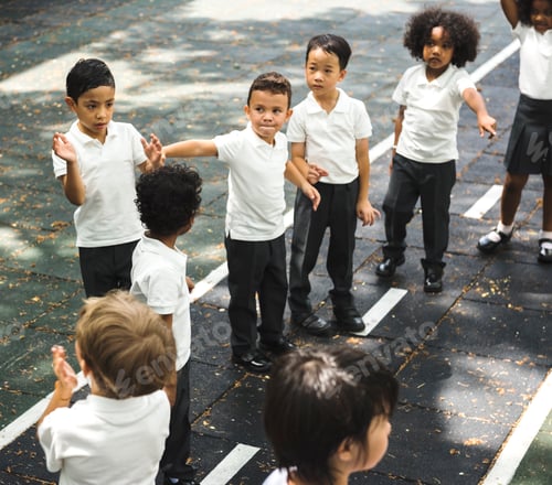 Preview: Group of diverse kindergarten students standing in line at playg