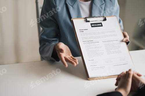 Preview: Woman submits job application, Interviewer reading a resume.