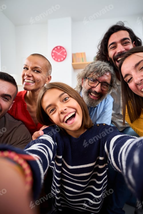 Preview: Cheerful Caucasian family taking selfie photo with funny expressions at home. Positive relations.