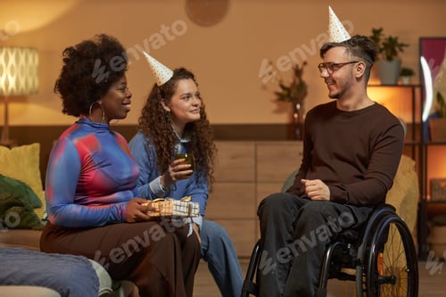 Preview: Man with Disability Celebrating Birthday and Wearing Party Hat