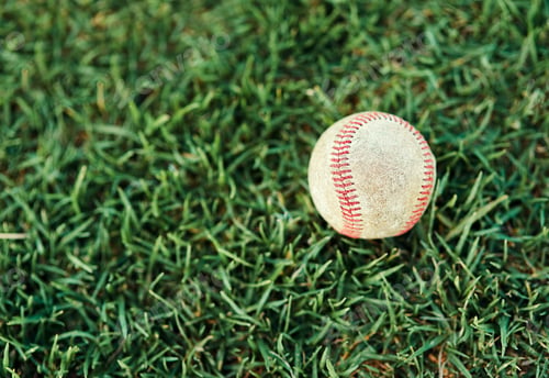 Preview: Lets play some baseball. Shot of a baseball lying on a field.