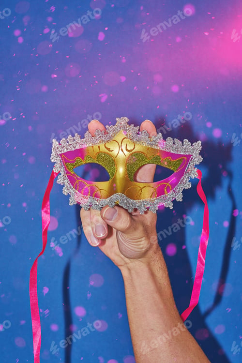 Preview: Mardi Gras carnival masquerade mask on blue background with confetti, copy space.