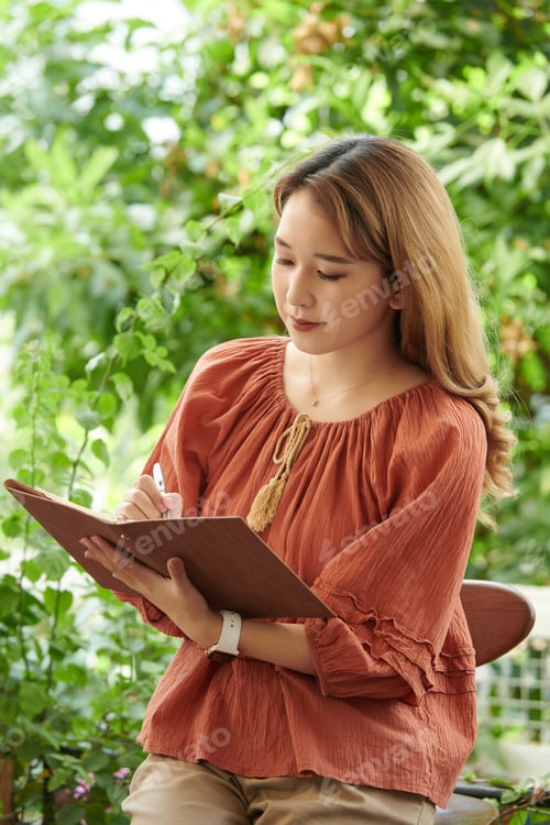 Preview: Woman Writing Down Ideas