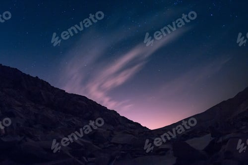 Preview: Hill with a lot of metal pieces under the beautiful starry sky with aurora