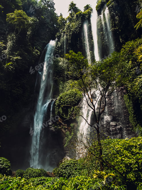 Preview: Vertical shot of the high cascades of Sekumpul Waterfalls in Bali, Indonesia