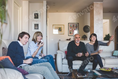Preview: Family together sitting couch watching tv