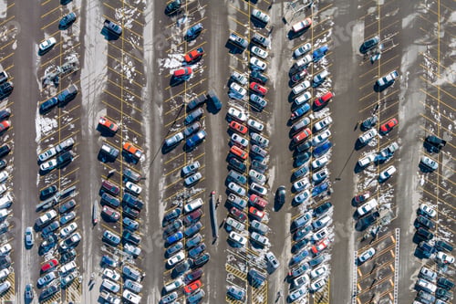 Preview: Aerial view a car on parking space in crowded parking lot car