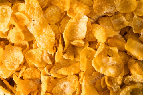 Preview: Full frame photo of crunchy golden cornflakes for breakfast