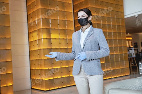 Preview: Friendly receptionist greeting the guests in the hall