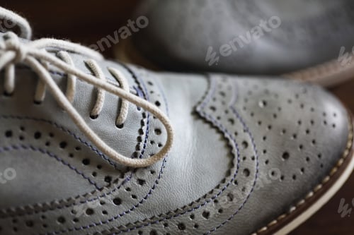 Preview: Grey oxford shoes on wooden background