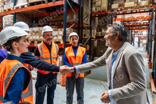 Preview: Warehouse manager shaking hands with logistics worker