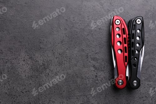Preview: Modern compact portable multitool on grey table, top view. Space for text