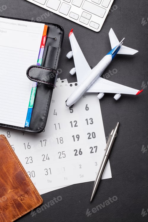 Preview: Business trip concept. Accessories on desk table