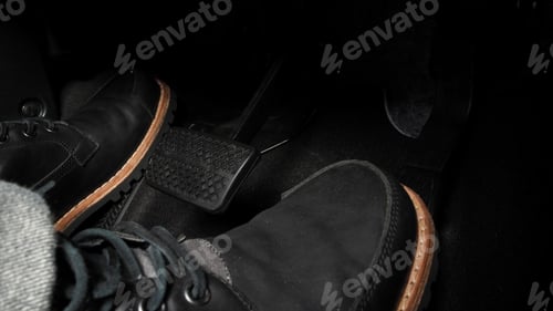 Preview: Close up foot press or push foot break and accelerate pedal of a car to drive ahead.