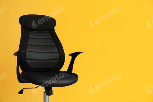 Preview: Modern office chair on yellow background. Space for text