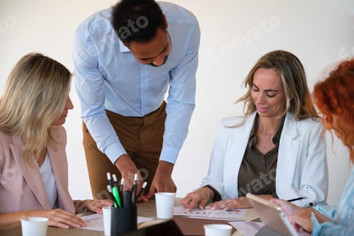 Preview: Business woman explaining some economic results to her African colleague.