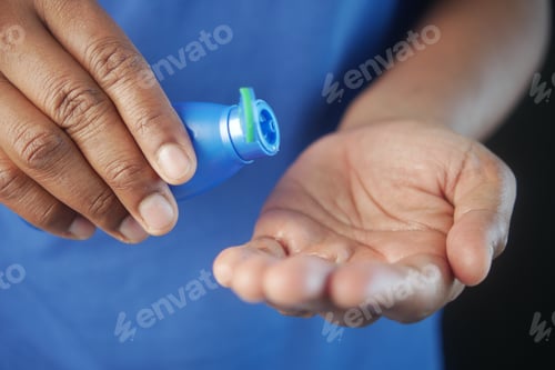 Preview: pouring hair oil on hand close up