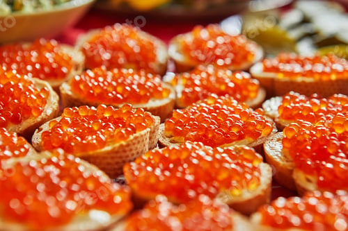 Preview: Baguette sandwiches with red caviar, butter on the festive table