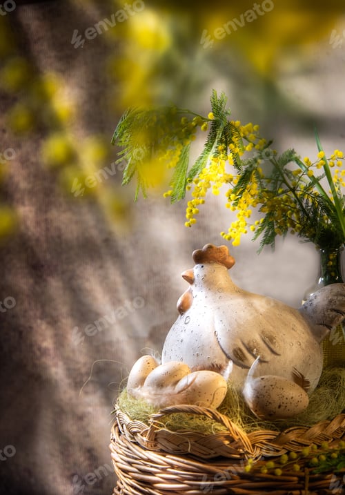 Preview: ceramic chicken in a basket with a bouquet of mimosa in a vase
