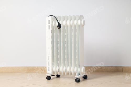 Preview: Concept of heating season, modern electric heater in room