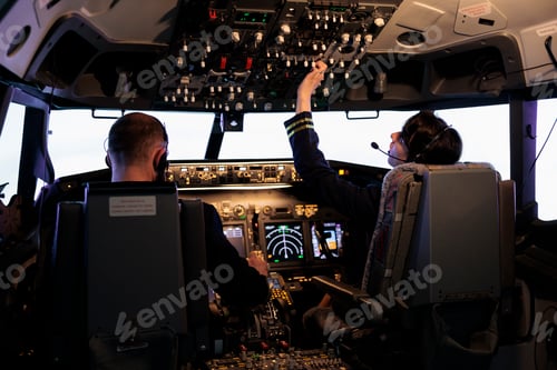 Preview: Captain and female copilot getting ready to fly plane