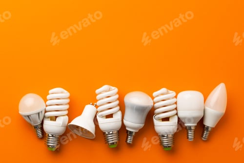 Preview: Many light bulbs on bright orange background