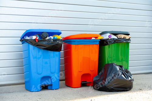 Preview: Three trash containers full of garbage near the building