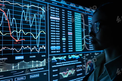 Preview: The businesswoman works with infographic on a black monitor.