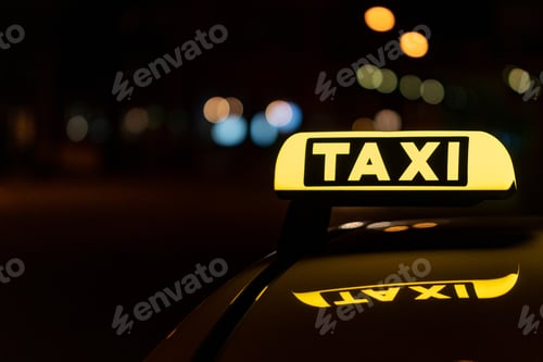 Preview: Close-up shot of a taxi sign in the night with bokeh lights in the background