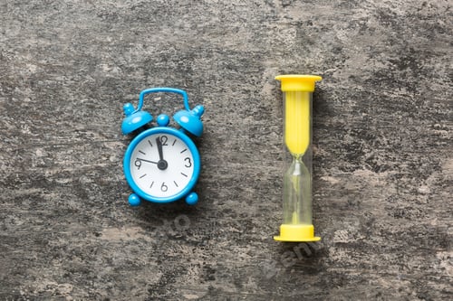Preview: hourglass and clock as time passing concept for business deadline, urgency and running out of time