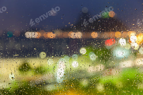 Preview: Rainy evening, water drops on a window