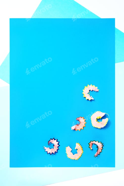 Preview: Pencil shavings background. Pastel light blue creative template. Back to school concept. Pattern.
