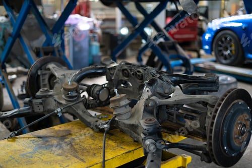 Preview: the disassembled car parts in the auto workshop, machine service station