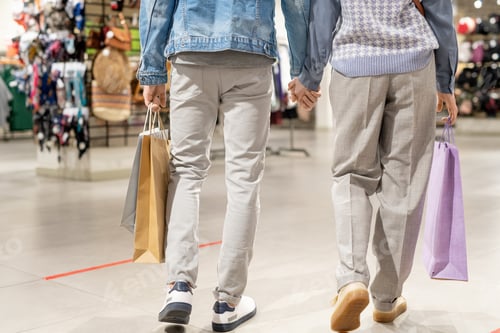 Preview: A pair of people walking in the mall with shopping bags