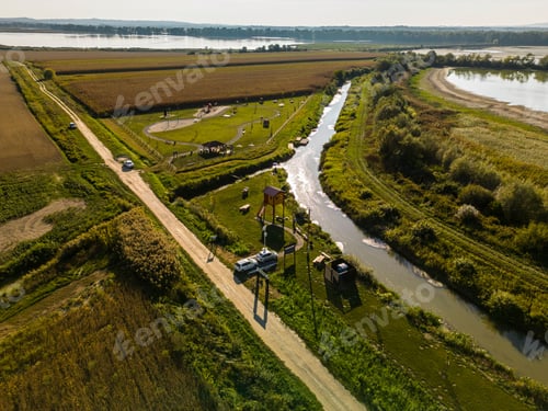 Preview: Aerial view of a field with small ponds next to the road