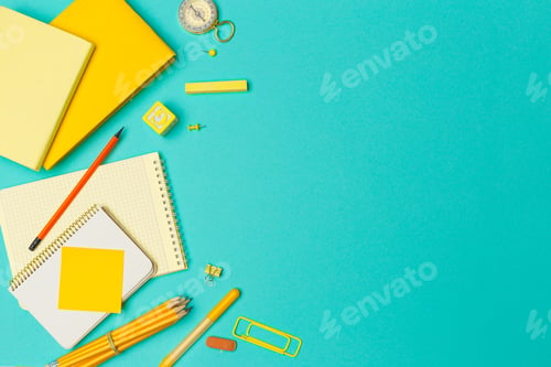 Preview: school supplies at colorful paper background