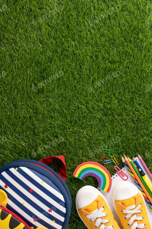 Preview: Top vertical view of colorful back to school supplies including shoes, backpack