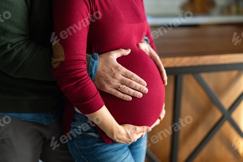 Preview: Man in love hugs his pregnant wife, they are waiting together for the baby's arrival. Love, family