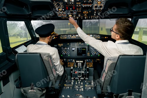 Preview: Airplane cabin Pilots check electronics by pressing buttons Passenger airliner preparation takeoff
