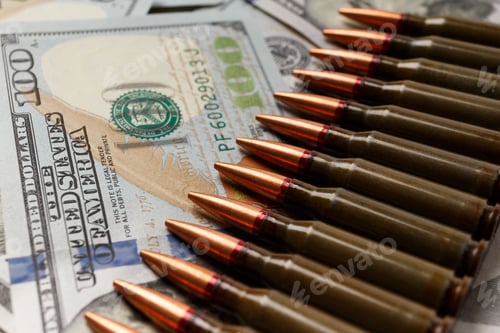 Preview: Bullets lie on American dollar bills, arms trade
