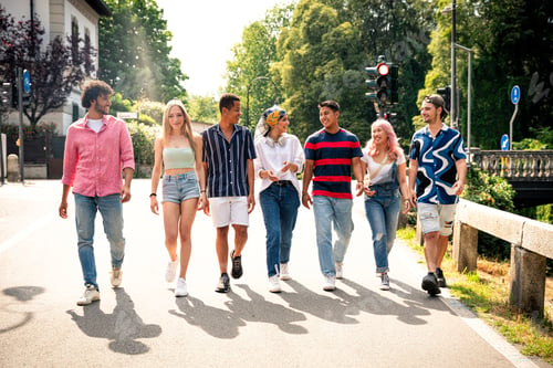 Preview: Group of multiethnic teenagers spending time outdoor and having fun