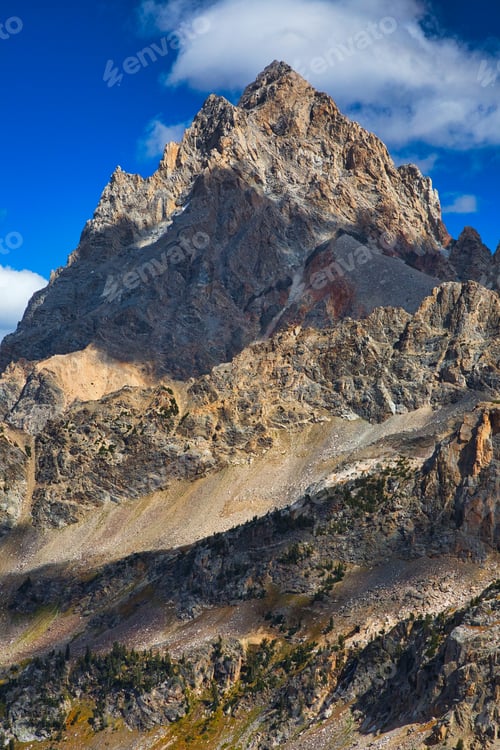 Preview: Scenic view of the beautiful Grand Teton Mountain peak in Wyoming, USA under a cloudy sky