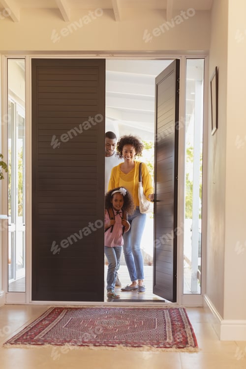 Preview: Front view of happy African American family returning sweet home