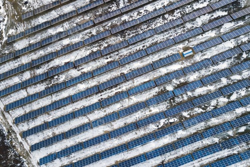 Preview: Blue solar photo voltaic panels system producing renewable clean energy in rural area in winter.