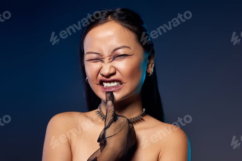 Preview: Mysterious charm of a young woman in creative makeup and corset against a dark backdrop