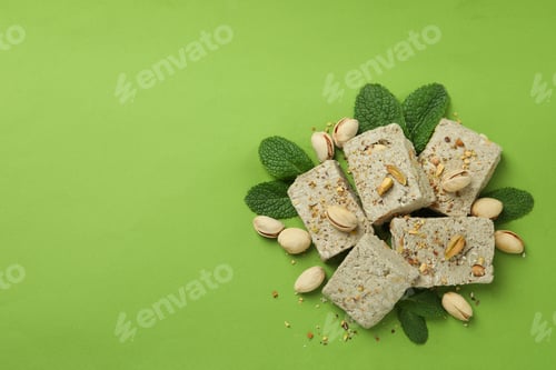 Preview: Concept of tasty food with halva on green background